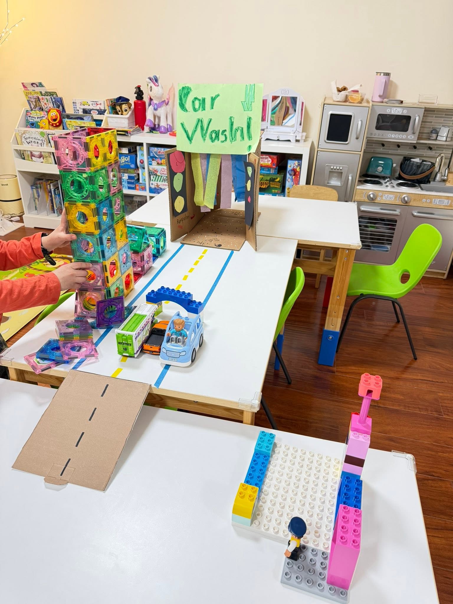 Creative car wash craft layout using colorful building blocks and toys