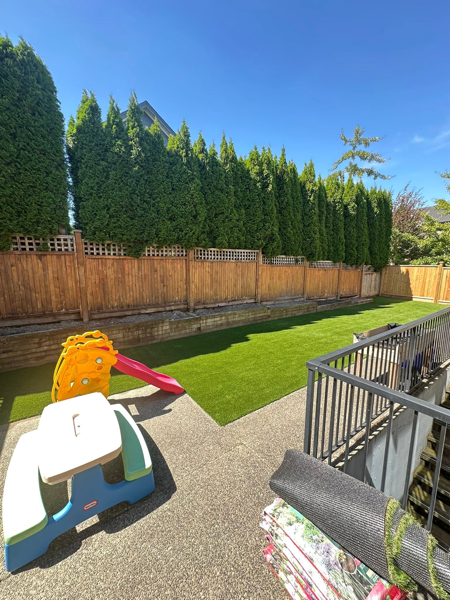 Secure grassy outdoor play area